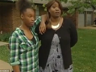 Natalie Williamson (right) was in her Oklahoma City home with her daughter (left) when she spotted a burglar attempting to climb into a window. Willamson sprung into action, authorities say, beating the man until he let go of the window.